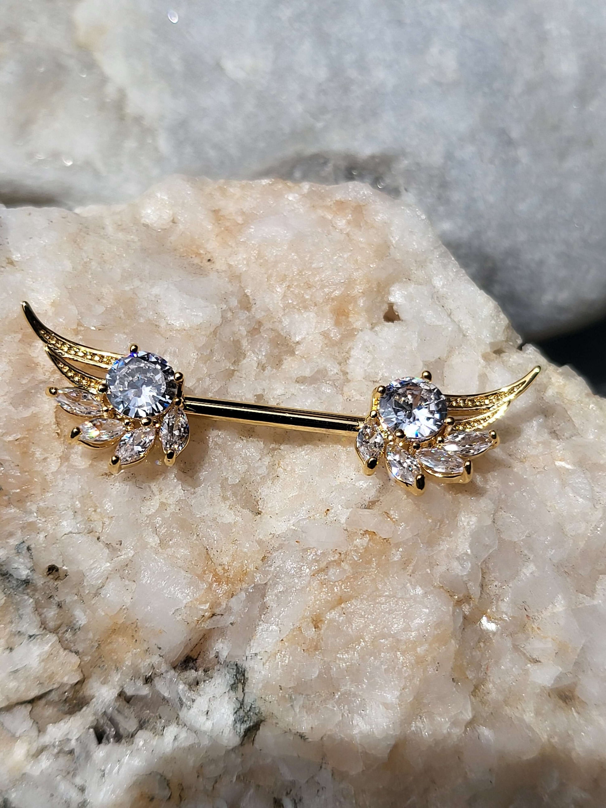 Pretty nipple piercing with marquise cut stones