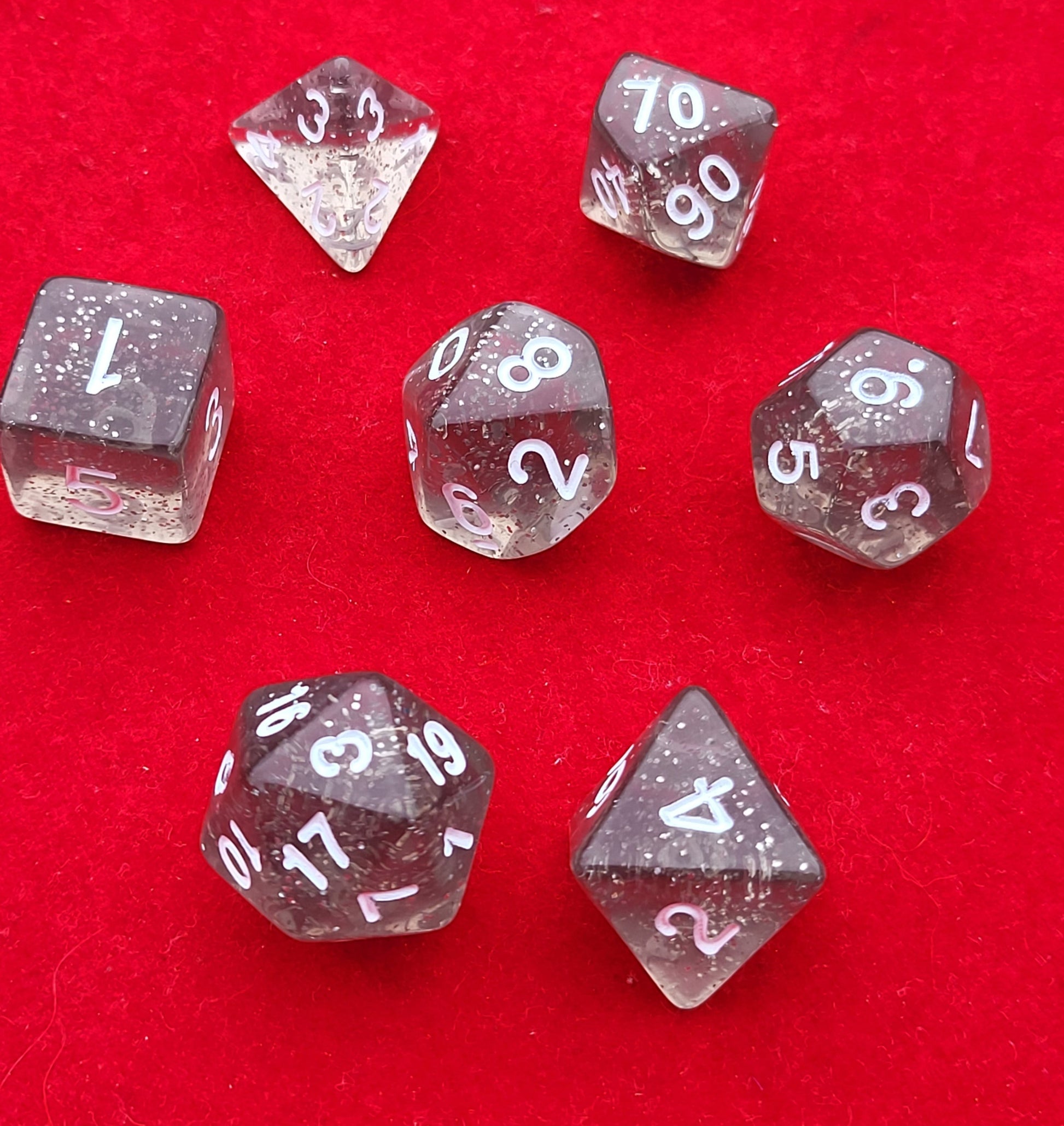 Celestial Glitter Role Playing Dice On Red Cloth